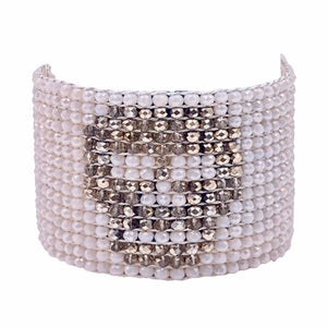 Millianna Crystal Skull Cuff Bracelet - Available at Shaylula Jewlery & Gifts in Tarrytown, NY and online. Embrace your inner glam rocker with this hand loomed cut crystal and pyrite cuff. Python skin magnetic closure. • Jet, cut crystal, python skin • 6.5" L x 1.75" W