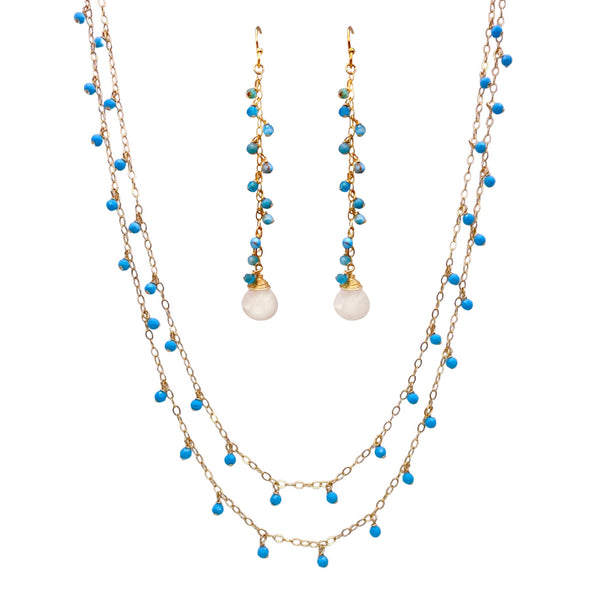 Sonya Renee Yes Please Necklace & Earring Set - Available at Shaylula Jewlery & Gifts in Tarrytown, NY and online. This Shaylula Exclusive set is comprised of the ever favorite Yes Please Necklace & Earrings, and is one of our best sellers! The double strand necklace features turquoise drops on a shimmer chain. The delicate, linear drop earrings have a cascade of turquoise beads and is finished with a wire wrapped moonstone briolette. Feminine and sexy! • Turquoise, moonstone, 14k gold filled