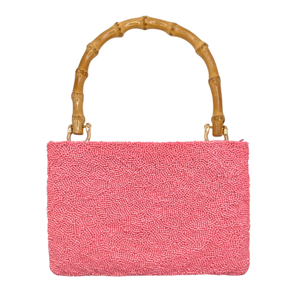 Tiana NY Palm Beach Beaded Bag available at Shaylula Jewlery & Gifts in Tarrytown, NY and online.This cheery handmade beaded bag is petite but is still big enough to hold all your essentials and it has a zipper closure to keep everything safe! It features a bamboo handle and a satin lining with a small interior pocket. • 8.5" W x 6" H