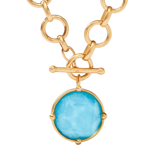 Julie Vos Honeybee Statement Necklace Available at Shaylula Jewlery & Gifts in Tarrytown, NY and online.Faceted sparkling imported glass with mother of pearl doublet on a lightly hammered link, finished with a front toggle closure. Cameo bee on reverse side. (Shown in white for scale) • 24K gold plate, imported glass, mother of pearl • 19" L