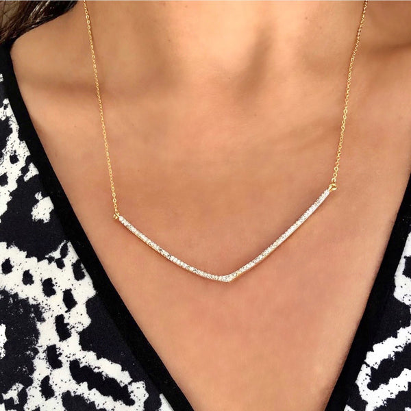 Shana Gulati Diamond V Pendan - Available at Shaylula Jewlery & Gifts in Tarrytown, NY and online. Stylish and uncomplicated - adding the final touch to an outfit is easily done with our popular diamond V pendant necklace. Mesmerizing on its own, but even better when layered. • 18k vermeil, diamond • 17" - 19" adjustable • Lobster clasp