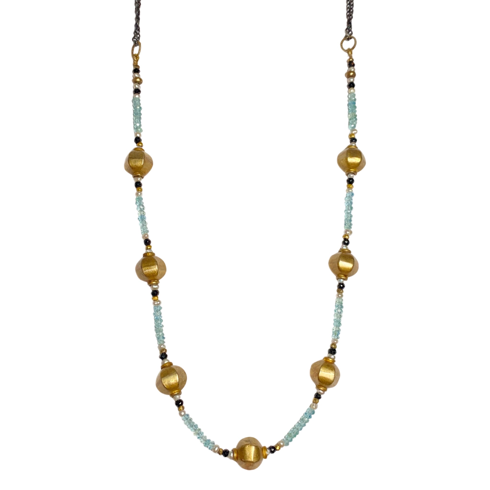 Lulu Designs' lantern necklace is substantial enough to stand on its sown or makes a fantastic layering piece. In-between the bronze sculpted lanterns are alternating faceted beads of blue zircon, onyx and fresh water pearls. Available at Shaylula Jewlery & Gifts in Tarrytown, NY and online.  • Yellow bronze, blue zircon, onyx, fresh water pearl, 18k gold vermeil  • 19" - 20" L adjustable  • Lobster clasp