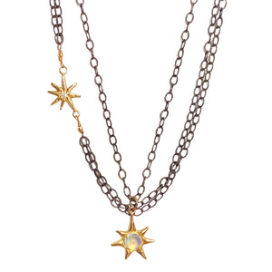 Robin Haley took the stars from the sky and put them in this mixed-metal, layered necklace. The oxidized silver chains contrast the 14k gold starbursts; one starburst is accented with diamonds and the pendant features a magical cabochon rainbow moonstone.Available at Shaylula Jewlery & Gifts in Tarrytown, NY