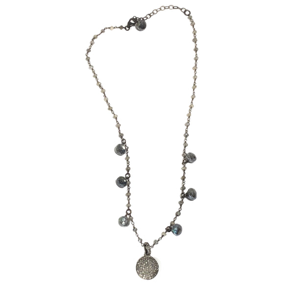 Add some casual sparkle to your everyday look with this simple diamond disc necklace on a strand of mystic labradorite.  • Sterling silver, mystic labradorite, diamond  • 16" - 18" L , .625" Diameter pendant  • Lobster clasp