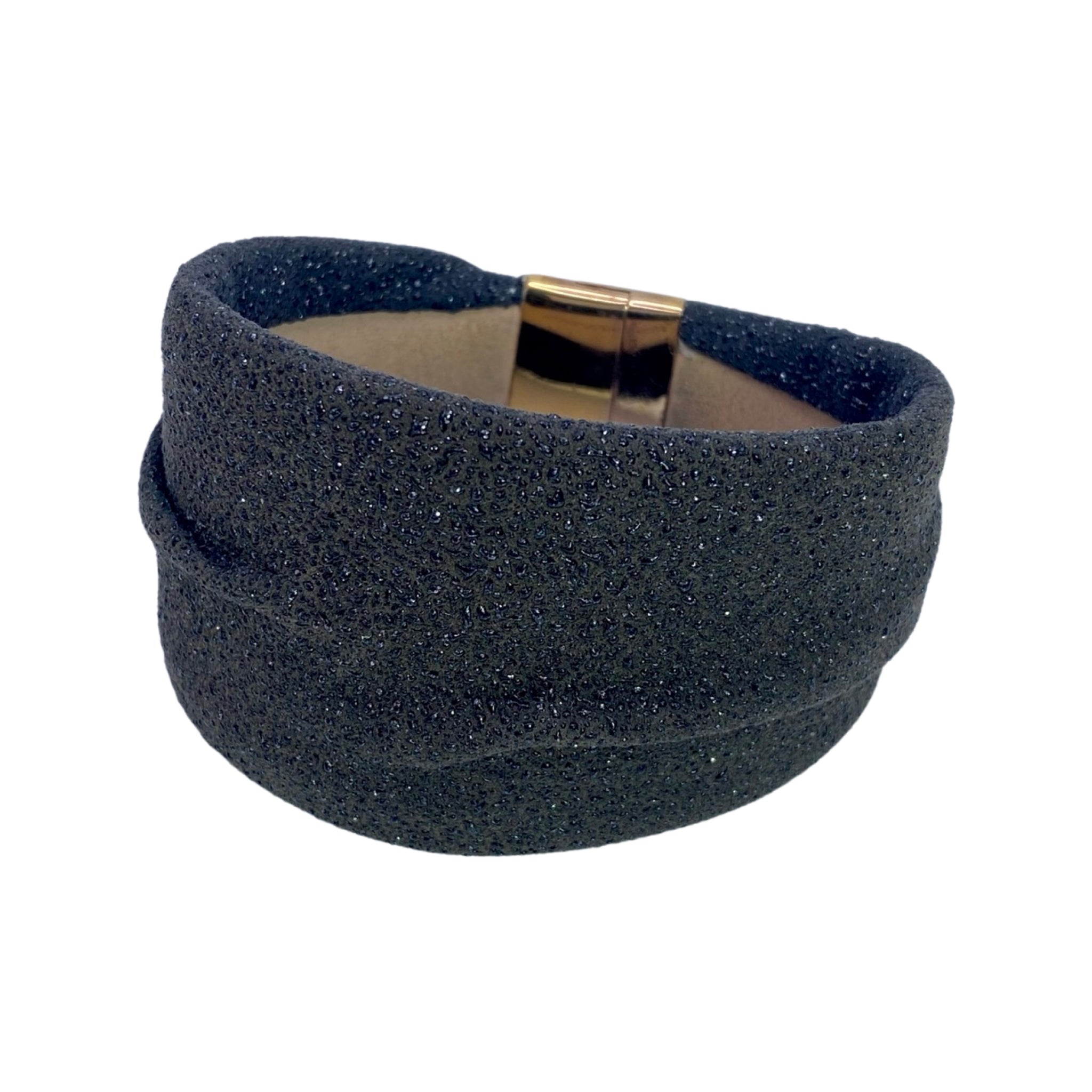 With a background in contemporary art, Marino Pesavento, shapes precious material into new forms creating real pieces of wearable art. His shagreen leather bracelet has an organic, sensuous look and feel and features a user-friendly magnetic clasp.  Available at Shaylula Jewlery & Gifts in Tarrytown, NY and online.   • Shagreen, 18k gold plated, magnetic clasp  • 7" L x 1.75" W  • Made in Italy