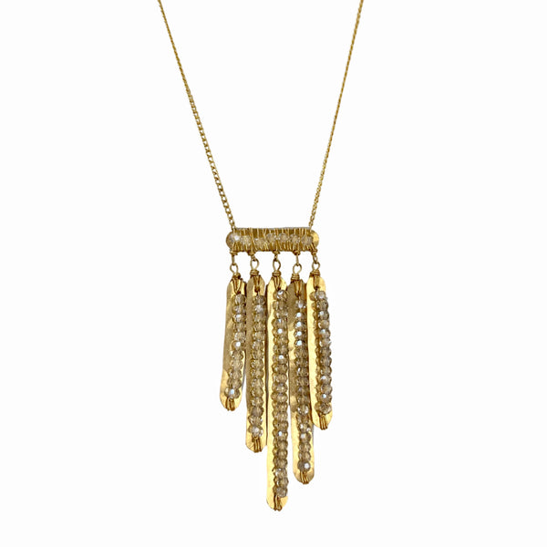 Dana Kellin Baby Fringe Necklace - This Dana Kellin necklace of hammered fringe of gold, wrapped with shimmering crystals, creates a fun, glamorous look that we just adore. or add a little extra something to your jeans and t-shirt. Available at Shaylula Jewlery & Gifts in Tarrytown, NY and online. • 14k gold filled, crystal • 17" L • Lobster clasp