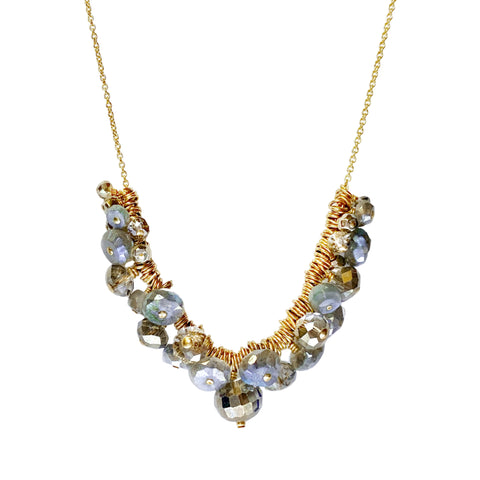  Dana Kellin Labradorite Cluster Necklace - Available at Shaylula Jewlery & Gifts in Tarrytown, NY and online.  This Dana Kellin necklace makes a statement without being overstated. A cascade of semi-precious gems float on individual gold rings coming together to form a cluster of soft, metallic-hued sparkle.  • Mystic labradorite, pyrite, crystal, 14k gold filled  • 16" L  • Lobster clasp