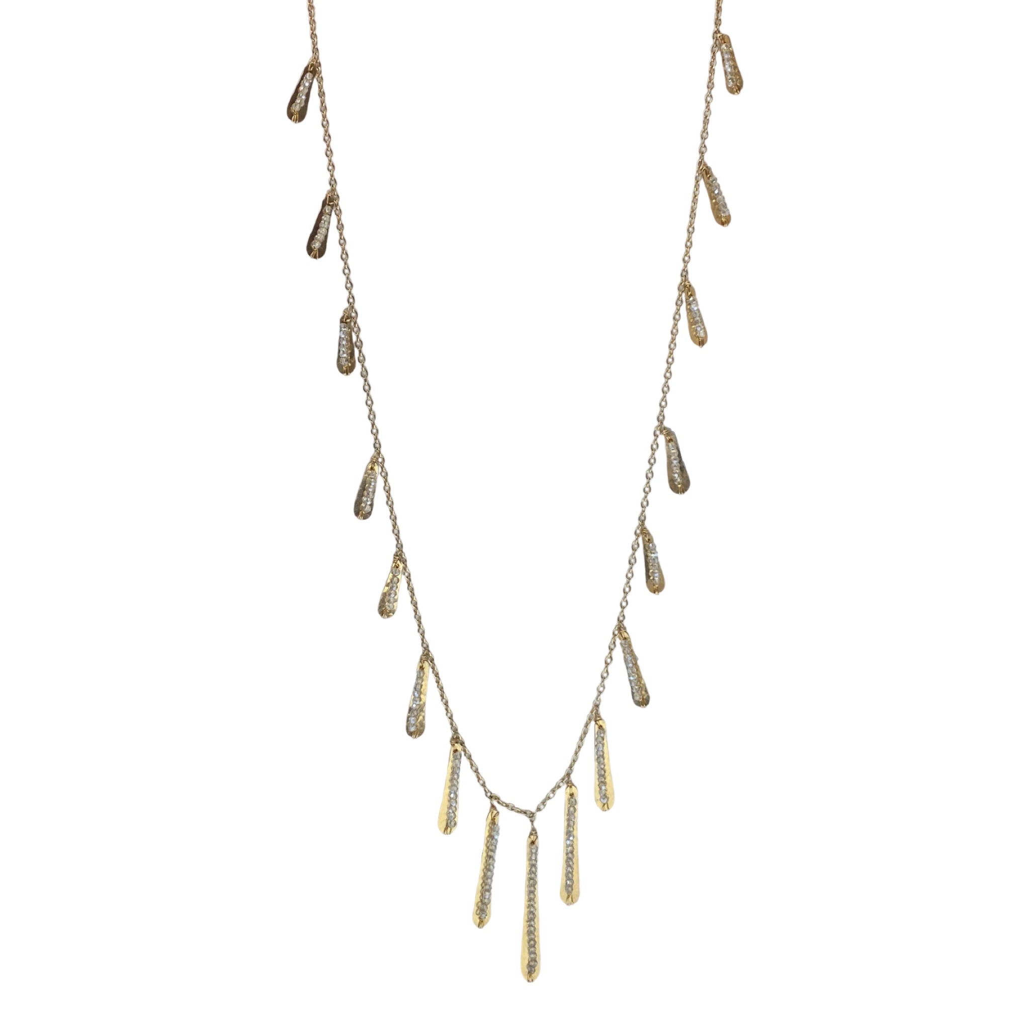 Dana Kellin Gold Fringe Necklace - This sassy Dana Kellin necklace has all the right moves; the hand-hammered fringe dances while the smokey crystals sparkle as they catch the light. Wear it for a night out or add a little extra something to your jeans and t-shirt.  Available at Shaylula Jewlery & Gifts in Tarrytown, NY and online. • 14k gold filled, crystal  • 30" L  • Lobster clasp