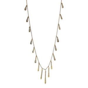 Dana Kellin Gold Fringe Necklace - This sassy Dana Kellin necklace has all the right moves; the hand-hammered fringe dances while the smokey crystals sparkle as they catch the light. Wear it for a night out or add a little extra something to your jeans and t-shirt.  Available at Shaylula Jewlery & Gifts in Tarrytown, NY and online. • 14k gold filled, crystal  • 30" L  • Lobster clasp