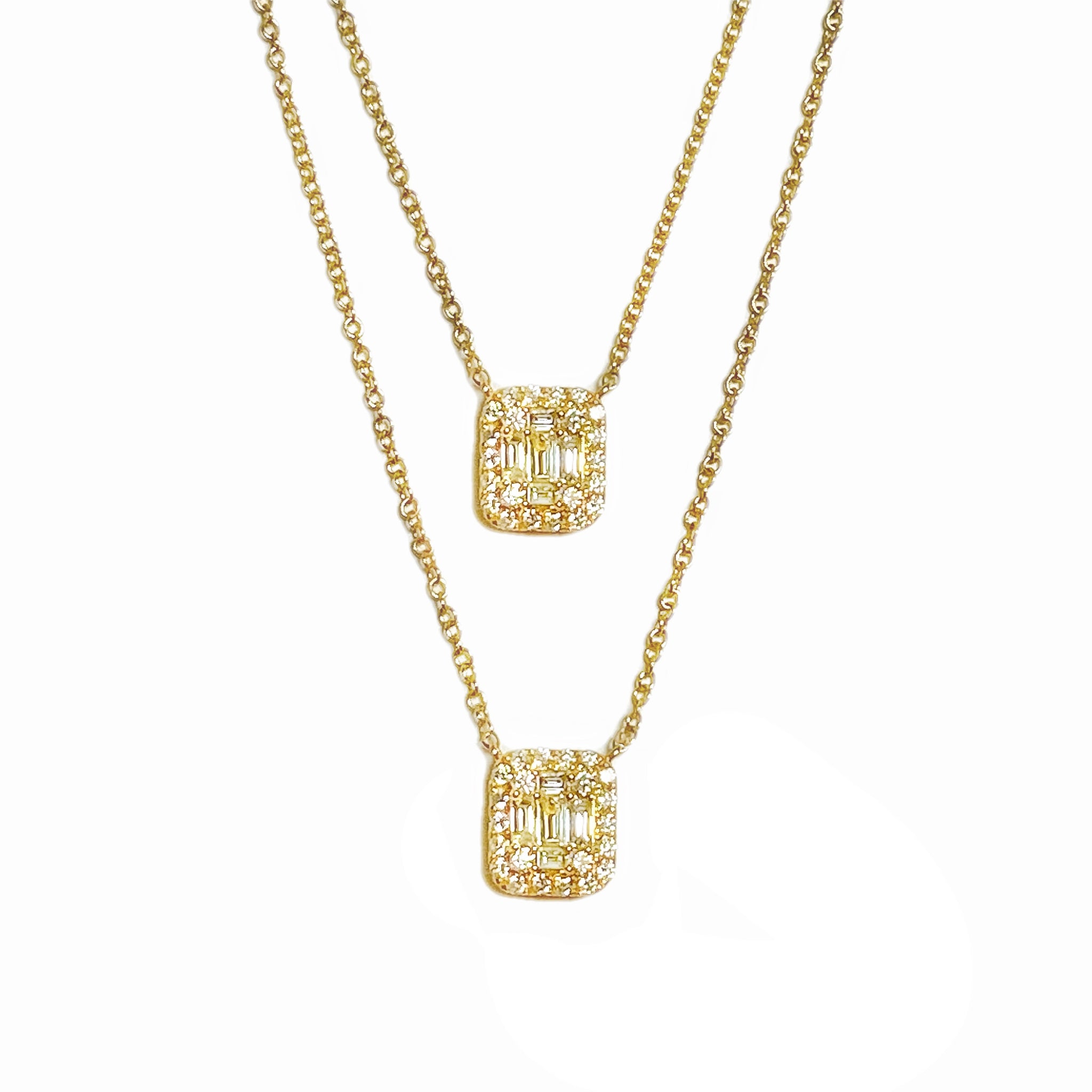 Gemtrends Double Baguette Diamond Necklace - Each pendant has 4 sparkling baguette diamonds surrounded by shimmering pave diamonds set in 18k yellow gold. The necklace gives the appearance of layering two pieces, but it's connected on the sides and has a single adjustable clasp. Just stunning.  • 18k gold, .62 tcw diamond  • 14" - 16" L adjustable  • Lobster clasp - Available at Shaylula Jewlery & Gifts in Tarrytown, NY and online.