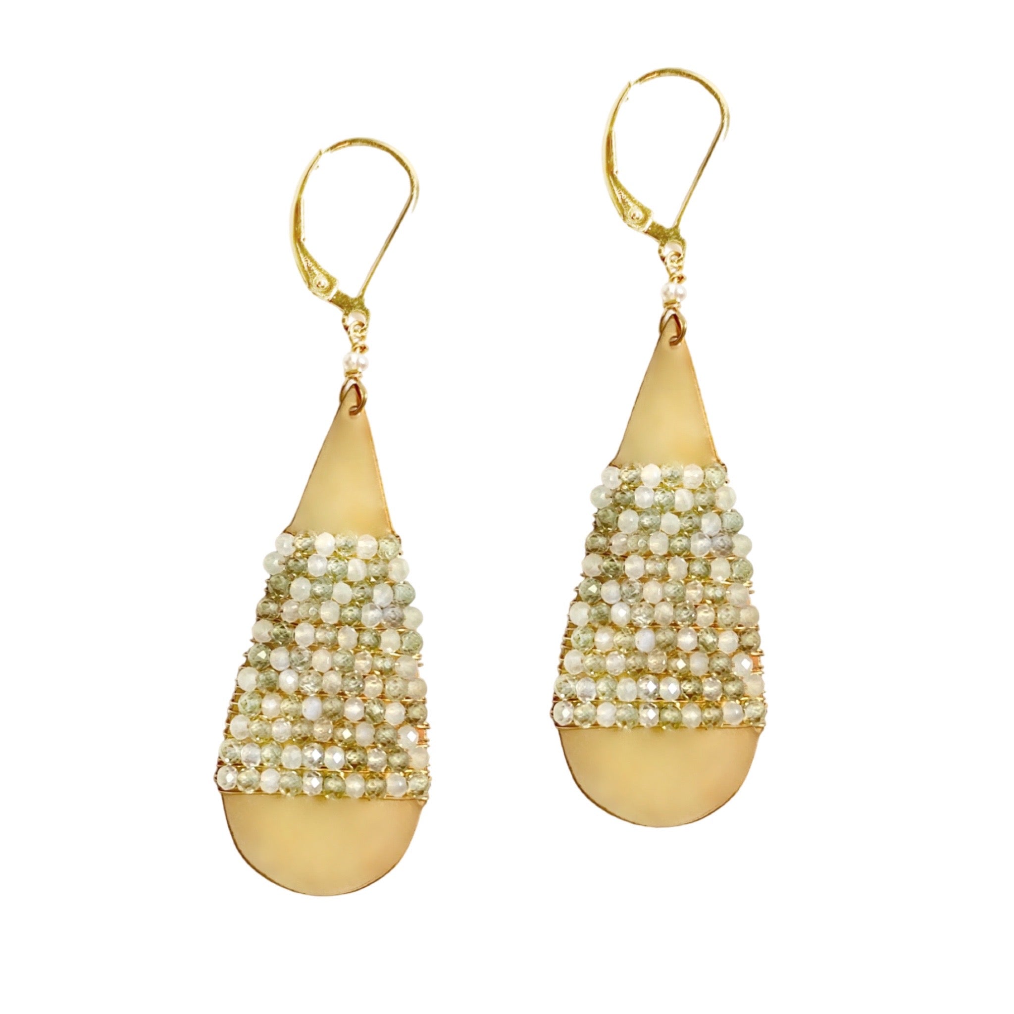 These Michelle Pressler gold buffed teardrop statement earrings are wired with moonstone and natural zircon to give them a bit of everyday sparkle. Available at Shaylula Jewlery & Gifts in Tarrytown, NY and online.