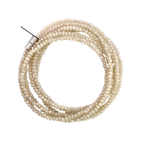 Millianna Single Strand Wrap - Sand - Available at Shaylula Jewlery & Gifts in Tarrytown, NY and online. The perfect, versatile, go-to staple in your jewelry wardrobe! With 5 ways to wear it, you're going to want one in every color! Hand-beaded microcut crystal strand that can be a necklace or wrap bracelet. Talk about making a statement!  • Cut crystal  • 43" L  • Magnetic clasp