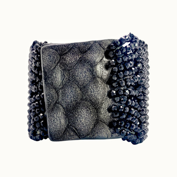 Millianna Crystal Skull Cuff Bracelet - Available at Shaylula Jewlery & Gifts in Tarrytown, NY and online. Embrace your inner glam rocker with this hand loomed cut crystal and pyrite cuff. Python skin magnetic closure.   • Jet, cut crystal, python skin  • 6.5" L x 1.75" W
