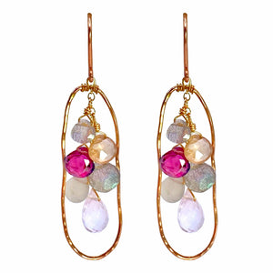 Vannucci Oval Cascade Earrings - Available at Shaylula Jewlery & Gifts in Tarrytown, NY and online. These earring are warm and earthy with just a touch of glam. Organic shaped rose gold hammered frame with a cascade of gemstones suspended from a chain.  • Rhodolite garnet, rose quartz, labradorite, pearl moonstone, zircon, sapphire, moss aquamarine  • 1.75" L  • 14k rose gold fill earwire
