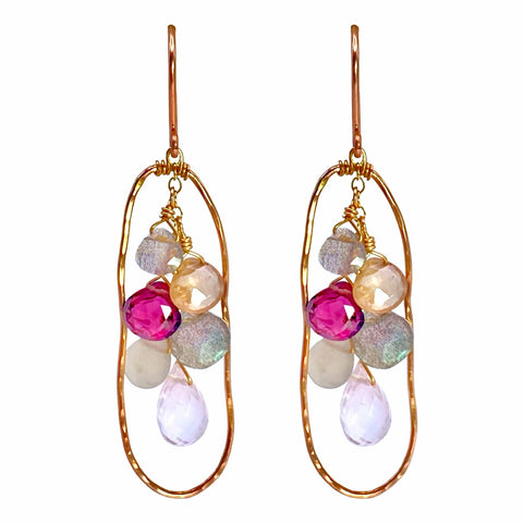 Vannucci Oval Cascade Earrings - Available at Shaylula Jewlery & Gifts in Tarrytown, NY and online. These earring are warm and earthy with just a touch of glam. Organic shaped rose gold hammered frame with a cascade of gemstones suspended from a chain.  • Rhodolite garnet, rose quartz, labradorite, pearl moonstone, zircon, sapphire, moss aquamarine  • 1.75" L  • 14k rose gold fill earwire