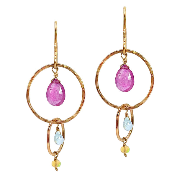 Vannucci Ruby Hoop Earrings - Available at Shaylula Jewlery & Gifts in Tarrytown, NY and online.  These cheerfully colored hoop earrings will brighten up any ensemble! Rubies, aquamarines and opals dangle from hammered 14k gold filled hoops.  • Ruby, aquamarine, opal, 14k gold filled  • 1.75" L  • 14k gold fill earwire