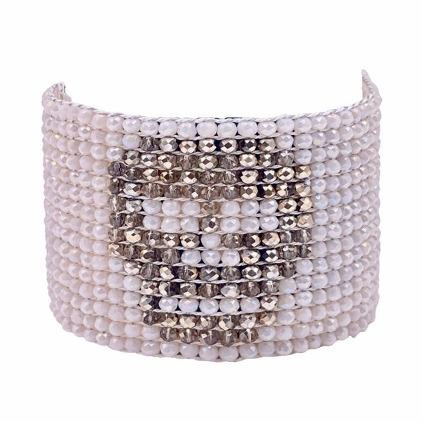 Millianna Crystal Skull Cuff Bracelet - Available at Shaylula Jewlery & Gifts in Tarrytown, NY and online. Embrace your inner glam rocker with this hand loomed cut crystal and pyrite cuff. Python skin magnetic closure. • Jet, cut crystal, python skin • 6.5" L x 1.75" W
