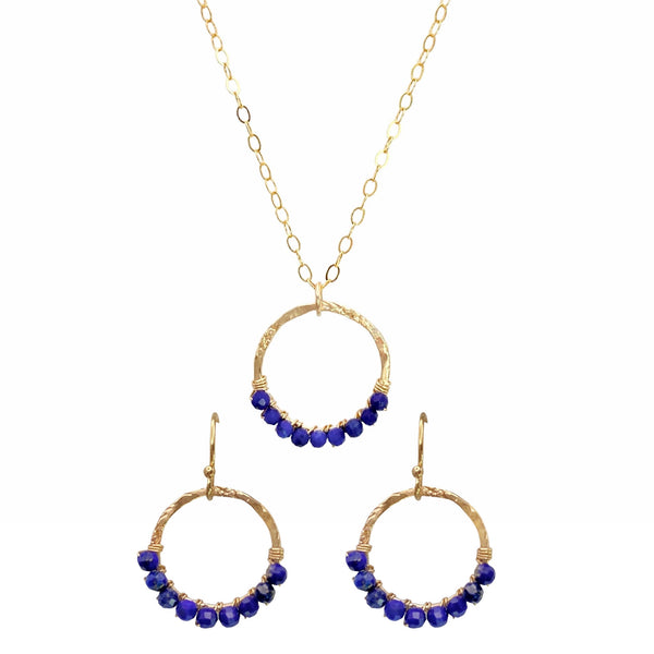 Sonya Renee Full Circle Necklace & Earring Set - Available at Shaylula Jewlery & Gifts in Tarrytown, NY and online. This Shaylula Exclusive set is comprised of the ever favorite Full Circle Necklace & Earrings, and is one of our best sellers! Bright Lapis beads are wire wrapped around a hammered gold filled frame and hangs from a delicate chain. Even prettier with the matching earrings, they make a fabulous gift for any one in your circle of friends. • Lapis, 14k gold filled 