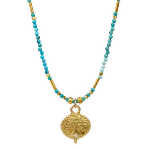 Lulu Designs Raina Necklace - Available at Shaylula Jewlery & Gifts in Tarrytown, NY and online. Raina is all about ethereal sparkle... A cast yellow bronze Gaia pendant accented with a diamond hangs from a strand of micro-faceted turquoise gemstones, interspersed by gold vermeil accents. Gaia was the goddess of earth and represents universal connection. Made with love in Mill Valley, CA. • Turquoise, diamond, yellow bronze, 18k gold vermeil • 16 - 18" L adjustable; Lobster clasp • .55" diameter pendant