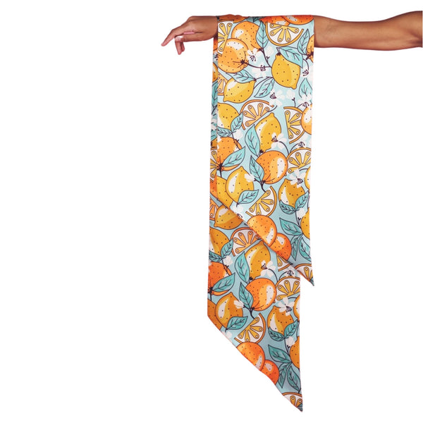 Powder UK Powder Citrus Scarf available at Shaylula Jewlery & Gifts in Tarrytown, NY and online. This quirky & fresh citrus print scarf is a super cute addition to any ensemble. It comes packed in an adorable limited-edition packaging making this the perfect gift for you or your loved one.  • 100% Polyester  • 9.45" W x 71" L