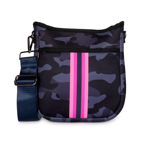 Haute Shore Jeri Epic Crossbody available at Shaylula Jewlery & Gifts in Tarrytown, NY and online.Looking for a small sized crossbody that will hold all your essentials while still remaining stylish? The Jeri is the bag for you! Top zipper closure and hidden front zipper pocket for organization. It includes 2 adjustable straps for mixing & matching - navy with pink stripes and solid navy. • Neoprene • Vegan friendly • 8.5" W x 2" D x 9.5" L
