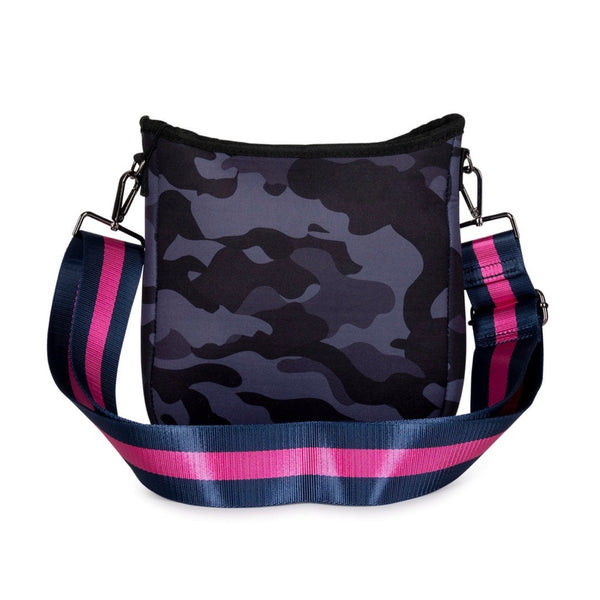 Haute Shore Jeri Epic Crossbody available at Shaylula Jewlery & Gifts in Tarrytown, NY and online.Looking for a small sized crossbody that will hold all your essentials while still remaining stylish? The Jeri is the bag for you! Top zipper closure and hidden front zipper pocket for organization. It includes 2 adjustable straps for mixing & matching - navy with pink stripes and solid navy. • Neoprene • Vegan friendly • 8.5" W x 2" D x 9.5" L