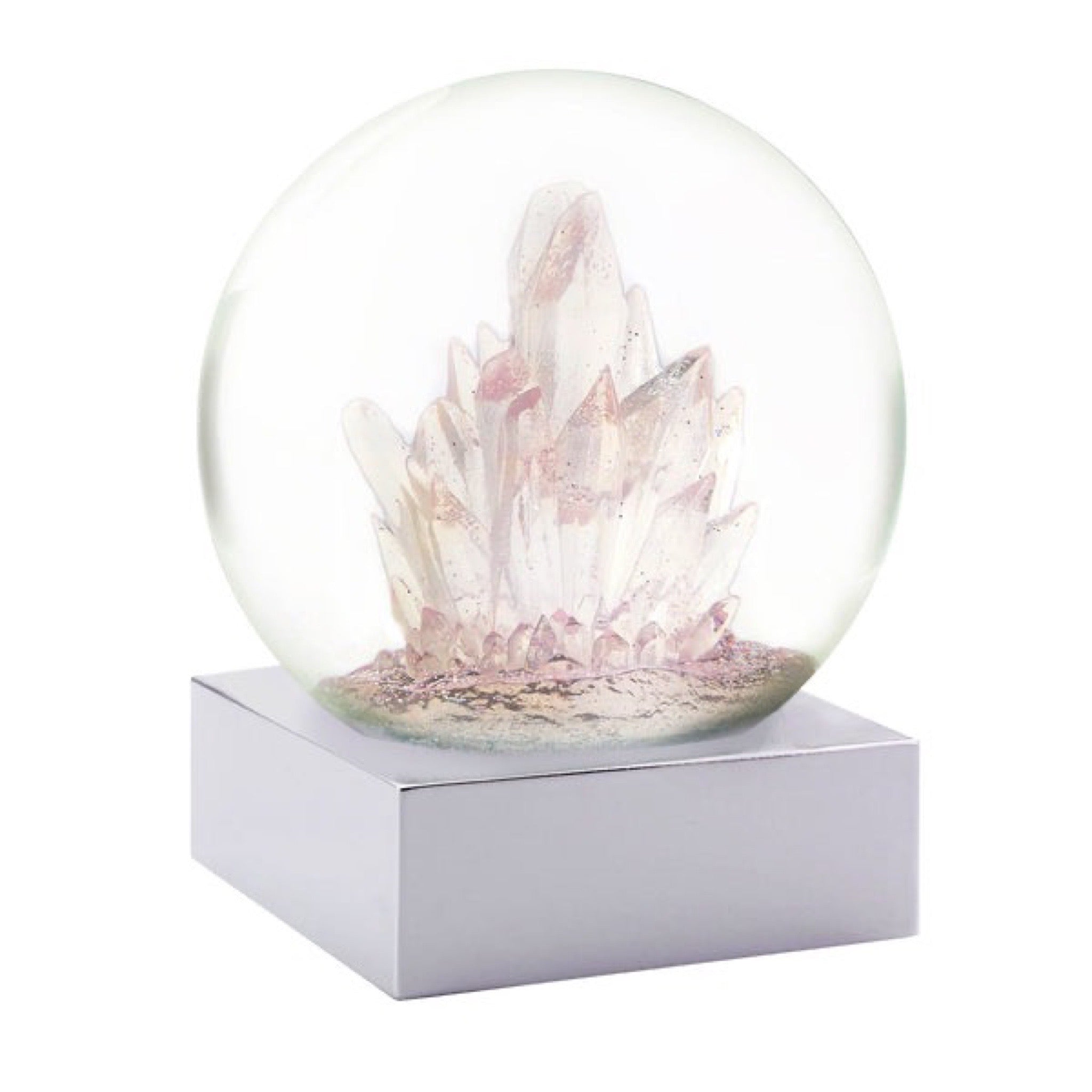 Cool Snow Globes Rose Quartz Crystal Snow Globe available at Shaylula Jewlery & Gifts in Tarrytown, NY and online. Often called the "love stone," rose quartz is said to bring peace, calm, emotional balance and stress relief - things we can all benefit from. Take a moment to gaze into our soothing water globe modeled from actual crystal formations showered in silver light..  • 4.5" H x 4" D