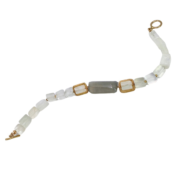 Dana Kellin Moonstone Bracelet is available at Shaylula Jewlery & Gifts in Tarrytown, NY and online. Smooth rectangular beads of white and grey moonstone come together in this neutral minimalist Dana Kellin bracelet. The soft color palette goes with everything! • 14k gold filled, moonstone • 7" L • Toggle clasp