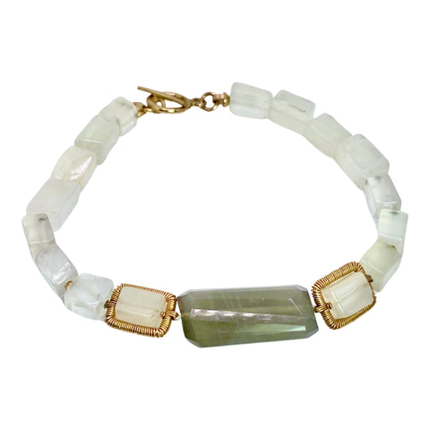 Dana Kellin Moonstone Bracelet is available at Shaylula Jewlery & Gifts in Tarrytown, NY and online. Smooth rectangular beads of white and grey moonstone come together in this neutral minimalist Dana Kellin bracelet. The soft color palette goes with everything! • 14k gold filled, moonstone • 7" L • Toggle clasp