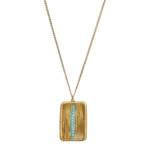 Dana Kellin Center of Attention Necklace available at Shaylula Jewlery & Gifts in Tarrytown, NY and online.  This Dana Kellin necklace showcases faceted blue zircon beads that shimmer in the center of a cocooned gold pendant.  • 14k gold fill, blue zircon  • 17" L, .75" L x .5" W pendant  • Lobster clasp