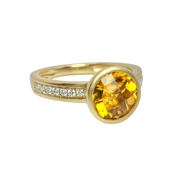 Bezel Set Whisky Citrine & Pave Diamond Ring Available at Shaylula Jewlery & Gifts in Tarrytown, NY and online. Deep whisky citrine is set in a simple ring of 14k yellow and has satin finish. The faceted round gem is bezel set with channel set diamond on sides.  • 14k, .16 ct dia, .1.81 ct citrine  • Size