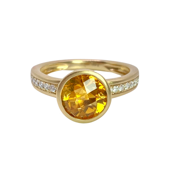 Bezel Set Whisky Citrine & Pave Diamond Ring Available at Shaylula Jewlery & Gifts in Tarrytown, NY and online. Deep whisky citrine is set in a simple ring of 14k yellow and has satin finish. The faceted round gem is bezel set with channel set diamond on sides.  • 14k, .16 ct dia, .1.81 ct citrine  • Size