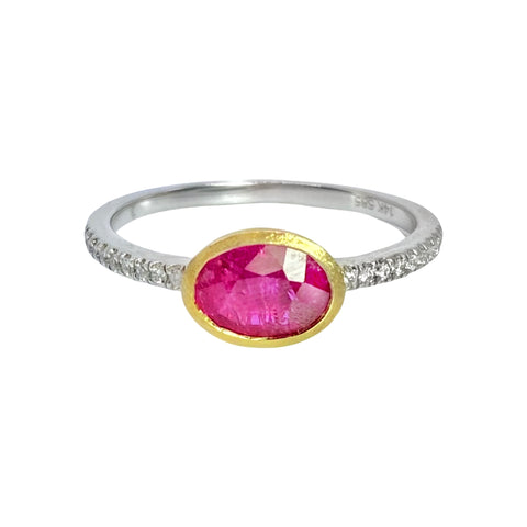 Bezel Set Ruby & Pave Diamond Ring Available at Shaylula Jewlery & Gifts in Tarrytown, NY and online.This beautifully crafted ring has a fresh, contemporary design. The juicy ruby sits in a brushed yellow gold bezel and is set on a white gold pave diamond band.  • 14k, .07 ct dia, .82 ct ruby  • Size