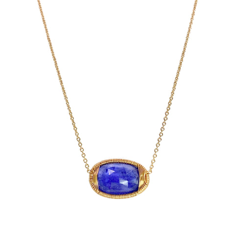 Dana Kellin Spun Wire Tanzanite Necklace available at Shaylula Jewlery & Gifts in Tarrytown, NY and online. Dana Kellin's intricate, 14k yellow gold wire wrapping showcases this spectacular faceted tanzanite - an incredible specimen of nature!  • 14k, tanzanite  • Lobster clasp