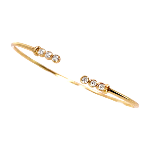 Dilaman Diamond Bezel Flex Cuff Bracelet available at Shaylula Jewlery & Gifts in Tarrytown, NY and online. This 14k gold cuff is a modern classic. Delicate and minimal worn on its own, even better stacked! • 14k, .35 ct