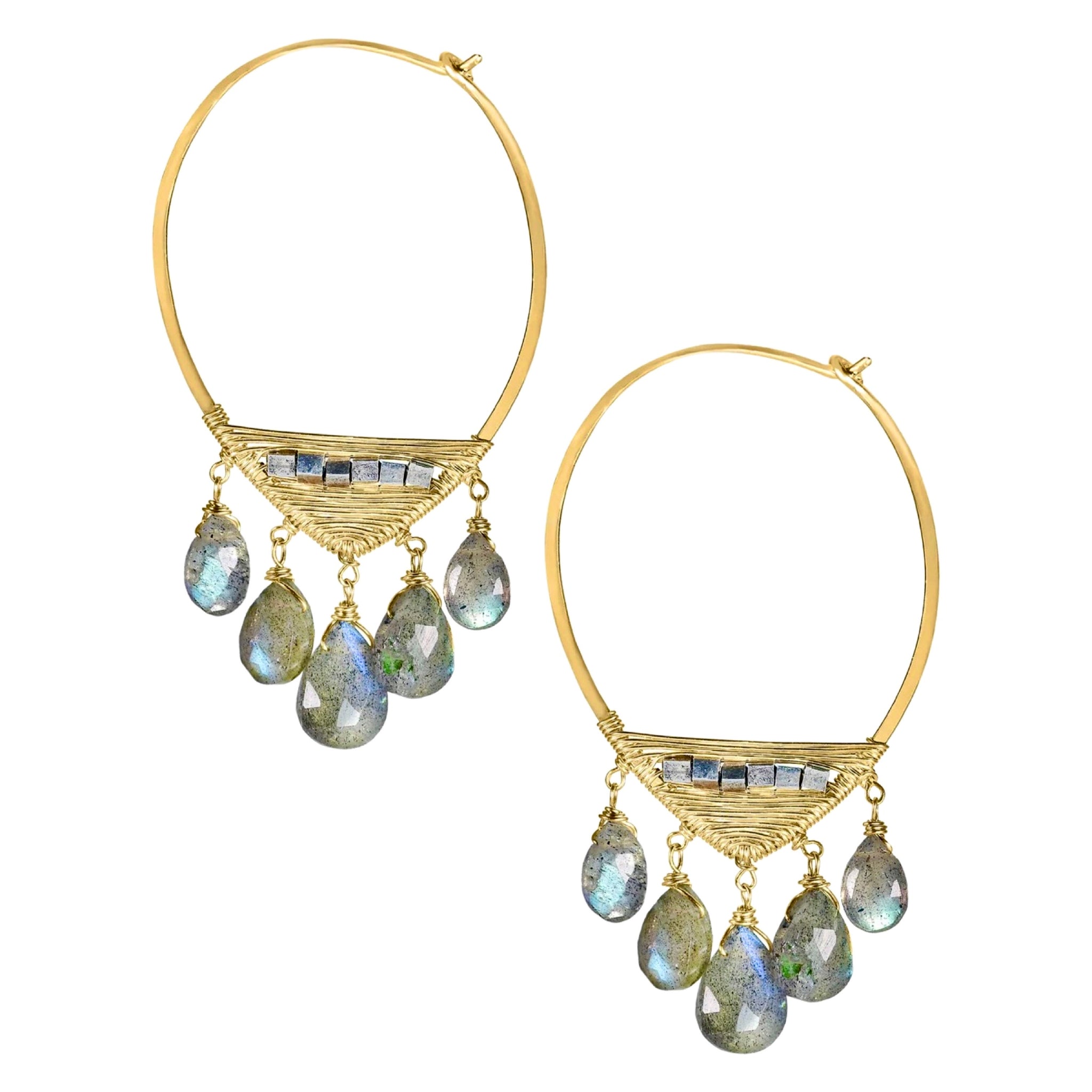 Dana Kellin Mezzo Hoop Earrings available at Shaylula Jewlery & Gifts in Tarrytown, NY and online. Cascading labradorite briolettes add a flurry of movement and flash to these mixed metal hoops by Dana Kellin.  • 14k gold fill, sterling silver, labradorite  • 1.81" L x .1"  W  • Earwire