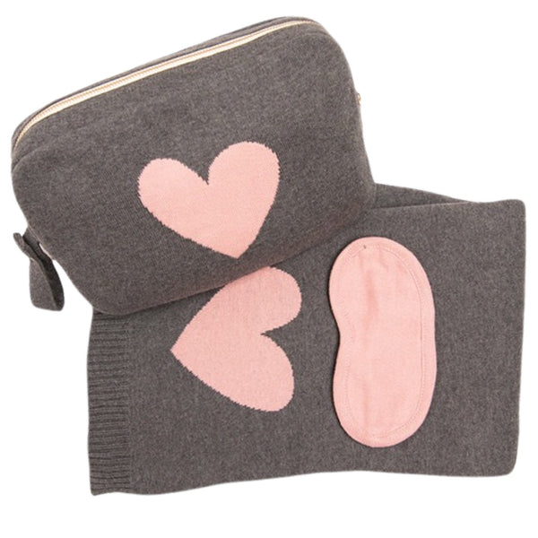 Pink Lemonade Travel Blanket & Sleep Mask Set available at Shaylula Jewlery & Gifts in Tarrytown, NY and online. A sweet, simple heart graphic adorns this sumptuous cotton, reversible blanket. A soft sleep mask completes this handy travel set in coordinating zip pouch.  • 40" W x 60" L • Organic combed cotton